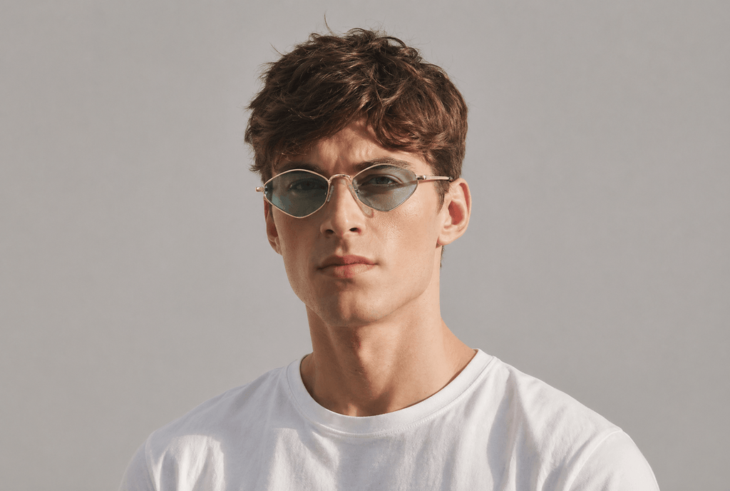 Man wearing sunglasses and a white t-shirt against a gray background Sea Blue