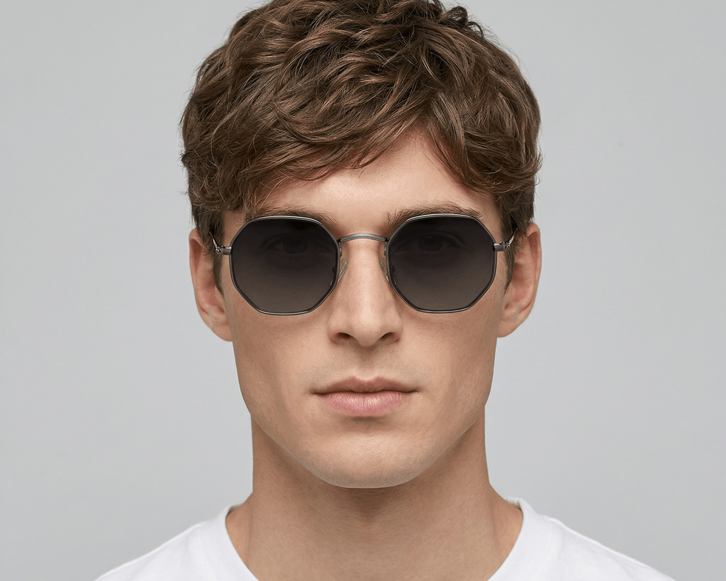 Man wearing sunglasses with a plain background