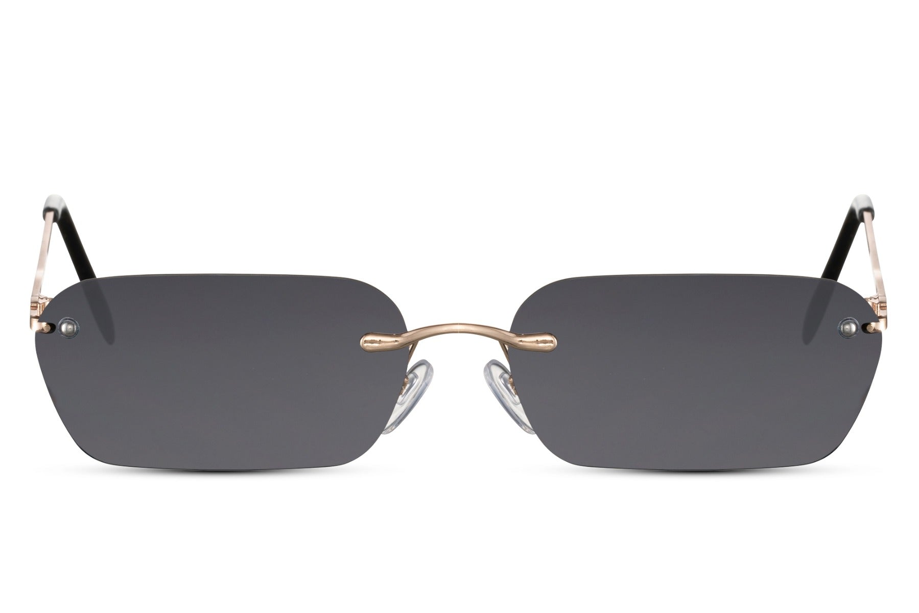 Sunglasses with gold frame and dark lenses on a white background