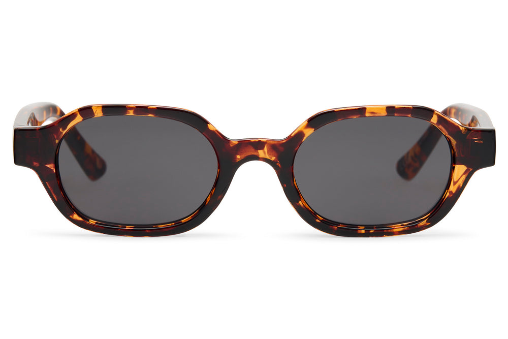 Sunglasses with tortoiseshell frame and dark lenses on a white background tortoiseshell