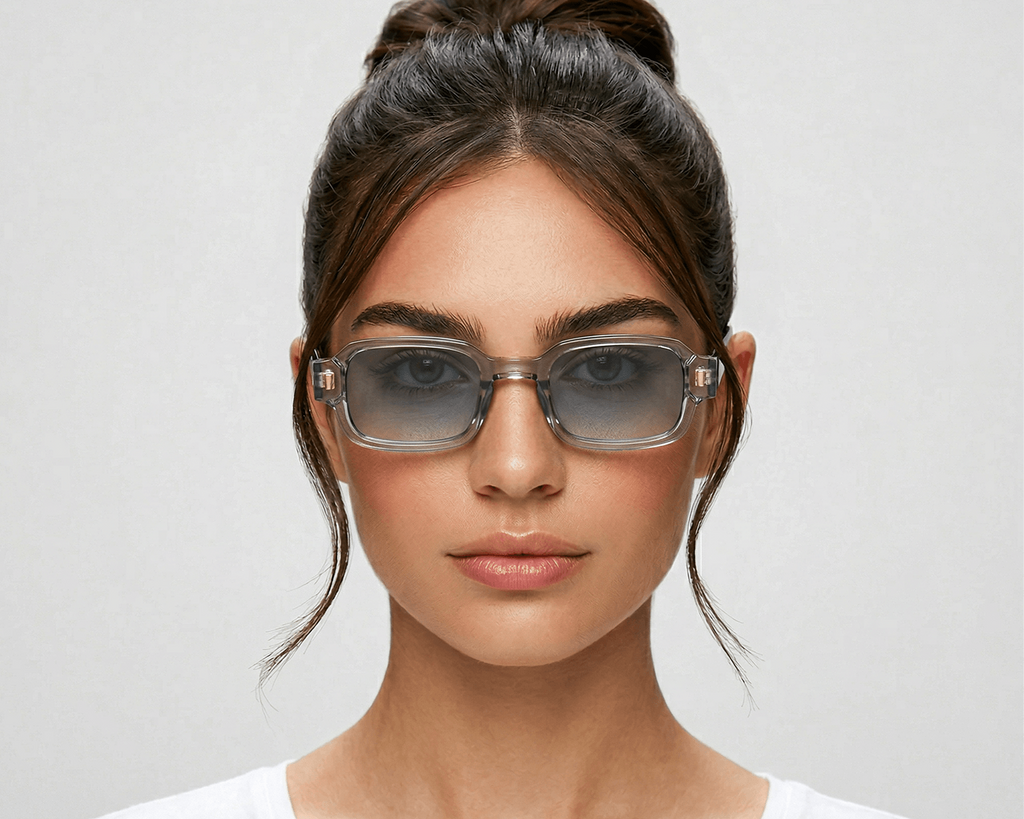 Woman wearing glasses with a plain background Clear blue