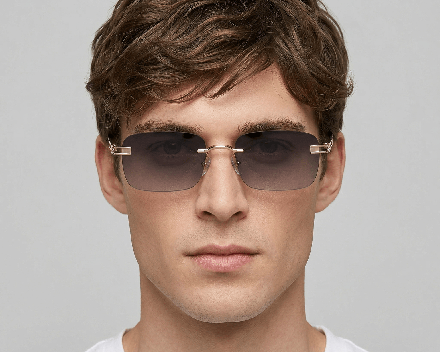 Man wearing sunglasses with a neutral background