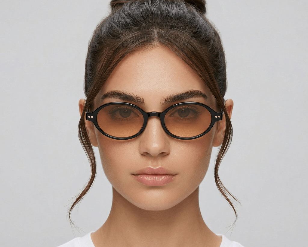 Woman wearing glasses with a plain background