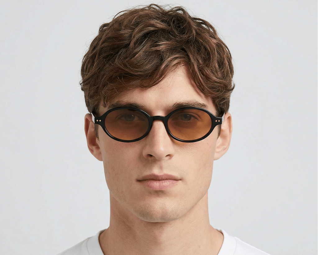 Man wearing sunglasses with a plain background