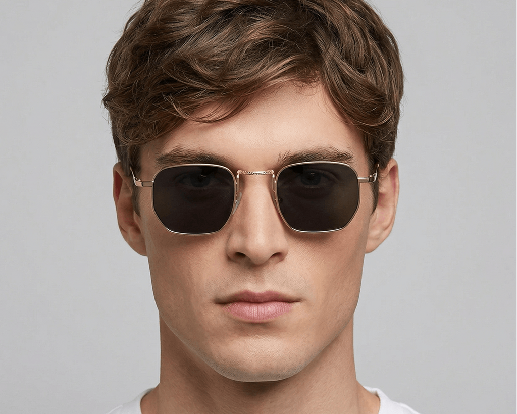 Man wearing sunglasses with a plain background Black
