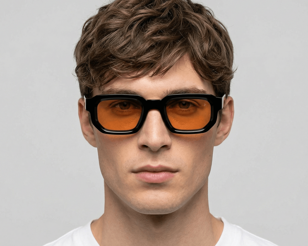 Man wearing sunglasses with a plain background Orange