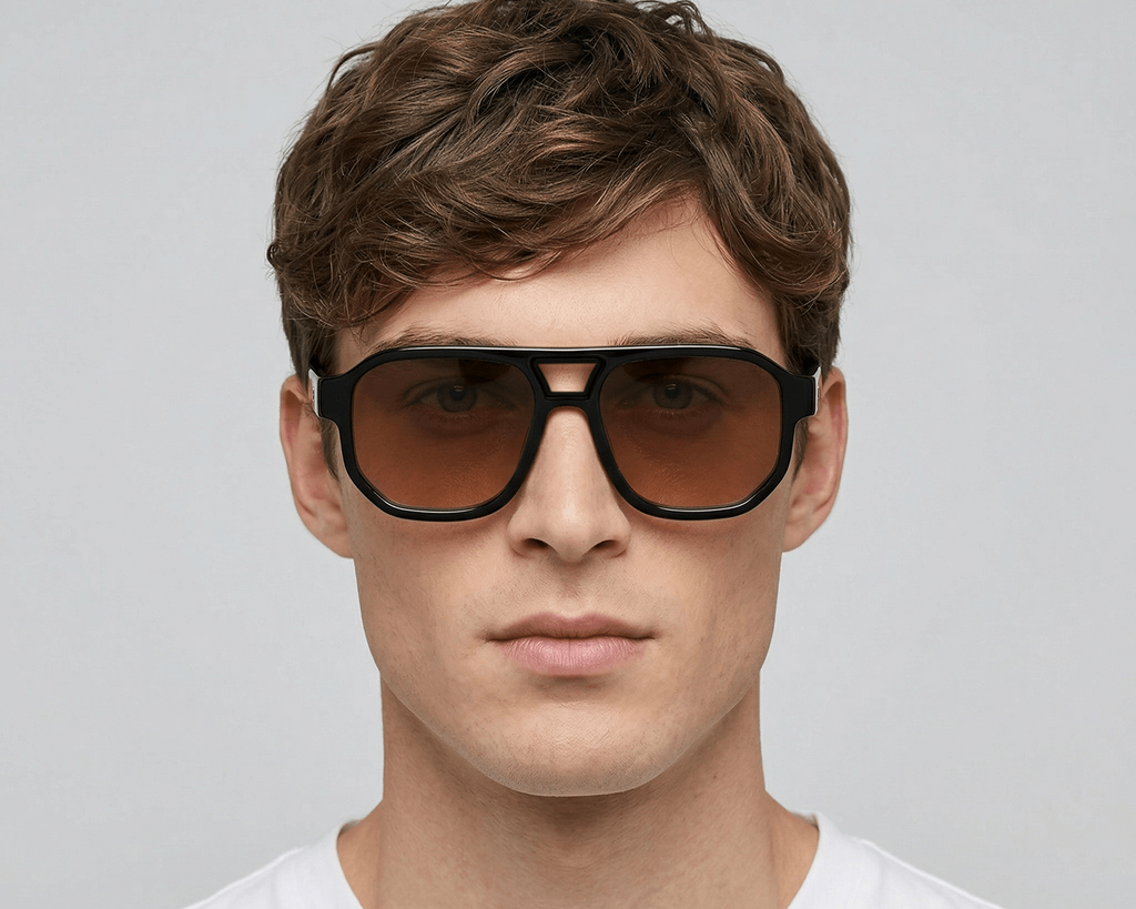 Man wearing sunglasses with a plain background Orange