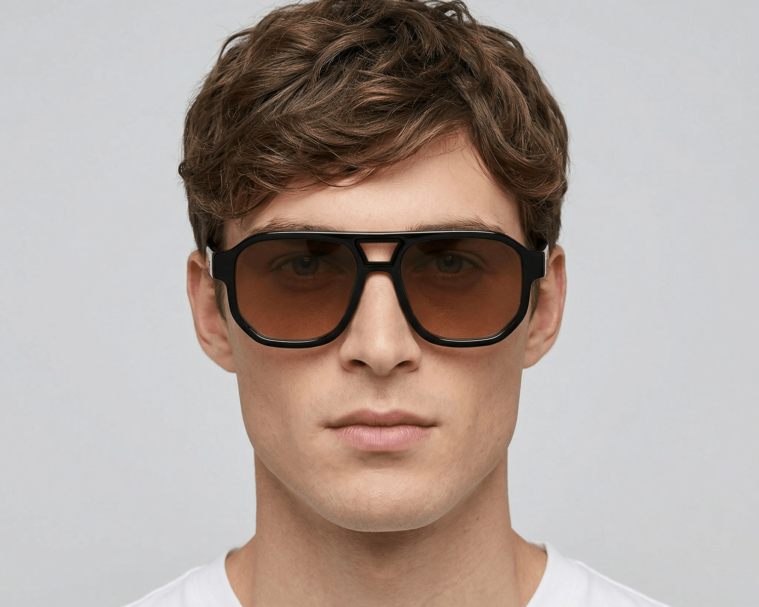 Man wearing sunglasses with a plain background Orange